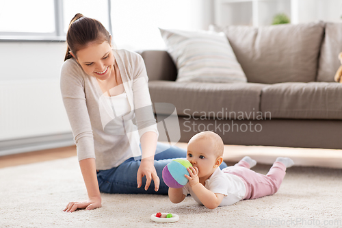 Image of happy smiling mother with little baby at home