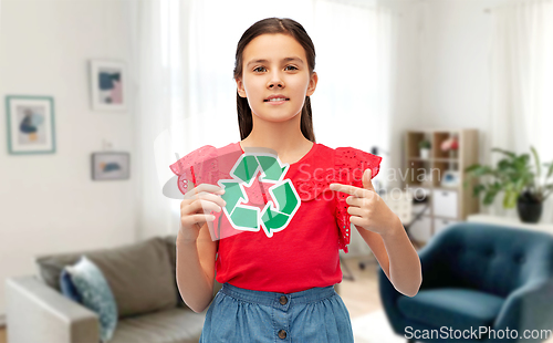 Image of smiling girl showing green recycling sign