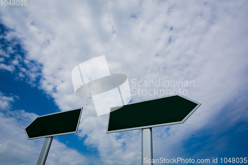 Image of Blank signpost over blue sky