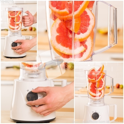 Image of Grapefruit white Blender on a wooden table.