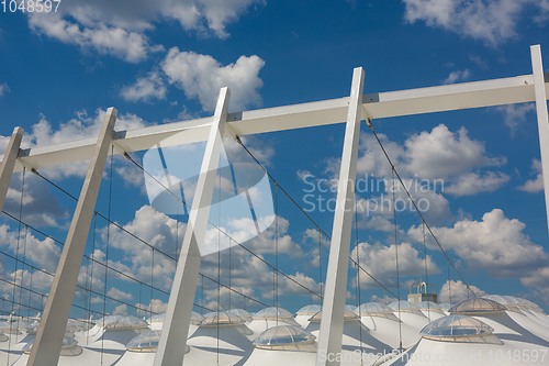 Image of Part of the football stadium on a sky with clouds