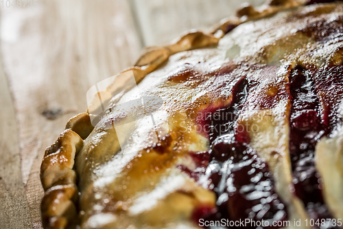 Image of Berry pie with blueberries close-up on a plate on the table. horizontal