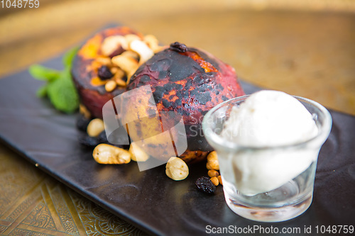 Image of Grilled peaches with nuts and ice-cream