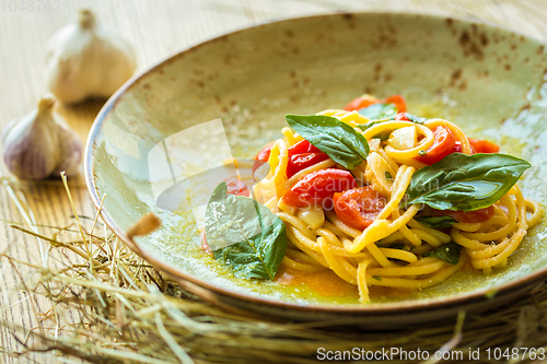 Image of Homemade pasta with Basil and tomatoes