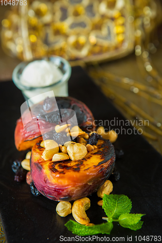 Image of Grilled peaches with nuts and ice-cream