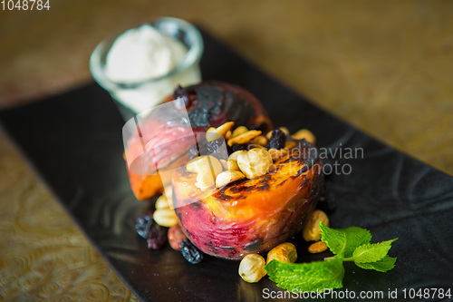 Image of Grilled peaches with nuts and ice-cream