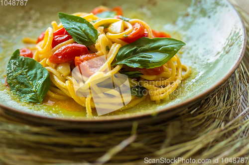 Image of Homemade pasta with Basil and tomatoes