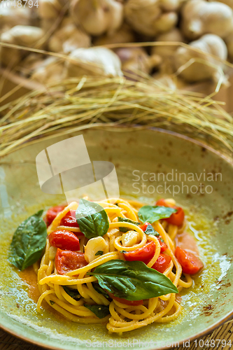 Image of Homemade pasta with Basil and tomatoes
