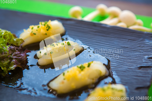 Image of Pieces of white tuna with herbs and sauce