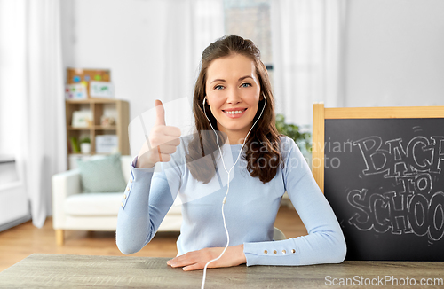 Image of teacher having online class or video call at home