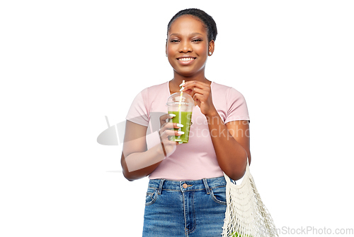 Image of happy woman with drink and food in reusable bag