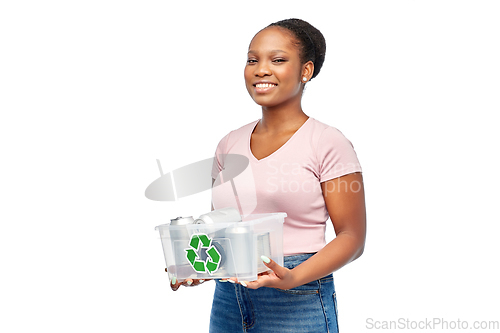 Image of african american woman sorting metallic waste