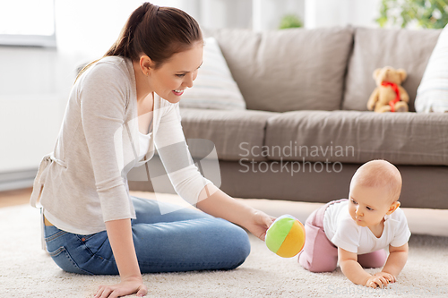 Image of happy smiling mother with little baby at home