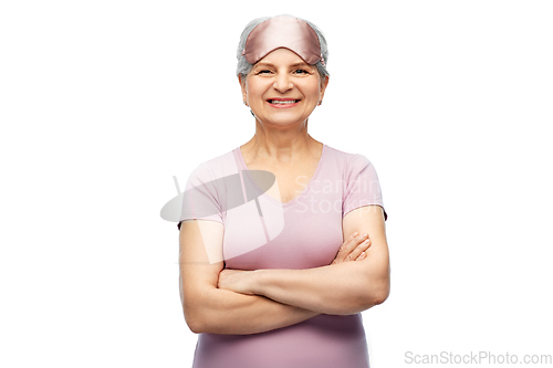 Image of senior woman in pajamas and eye sleeping mask