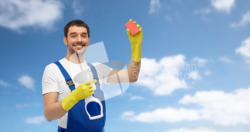 Image of male cleaner cleaning with sponge and detergent