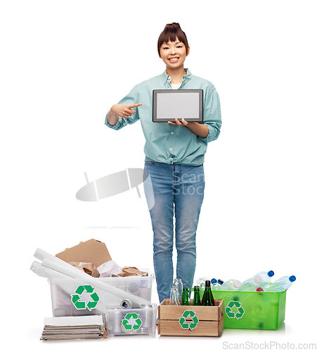 Image of smiling asian woman with tablet pc sorting waste