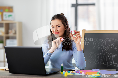 Image of teacher having online class of arts and crafts