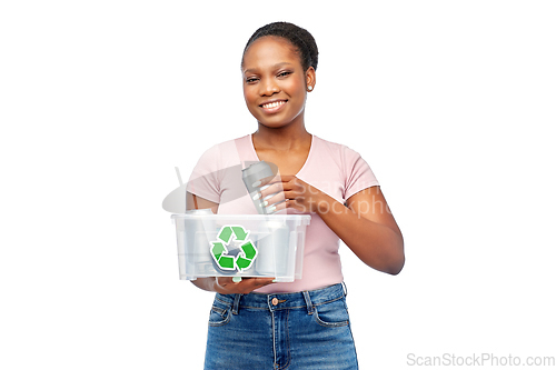 Image of african american woman sorting metallic waste