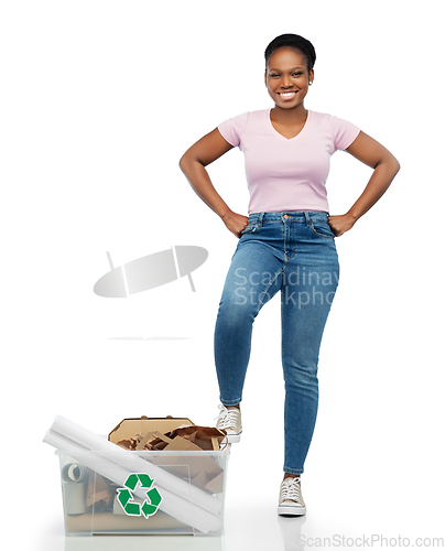 Image of happy african american woman sorting paper waste