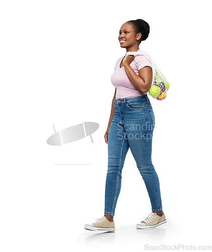 Image of african woman with food in reusable string bag