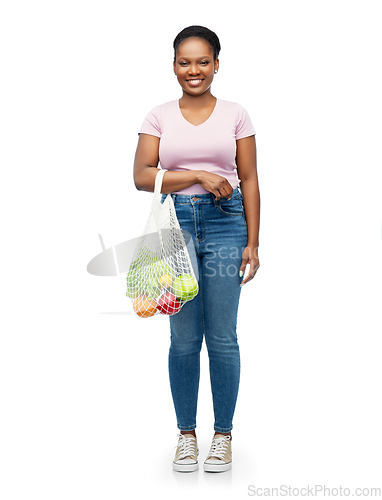 Image of african woman with food in reusable string bag