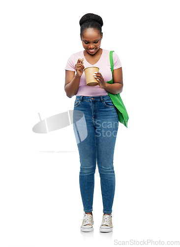 Image of happy woman with reusable bag for food and wok