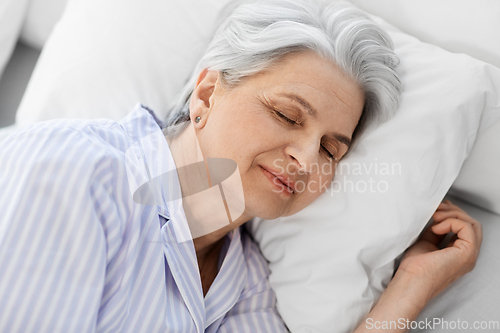 Image of senior woman sleeping in bed at home bedroom