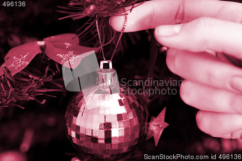 Image of Christmas ornaments on tree.