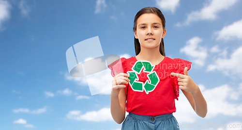 Image of smiling girl holding green recycling sign