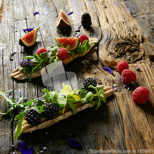 Image of Three portions of homemade dessert fresh berries on a wooden background