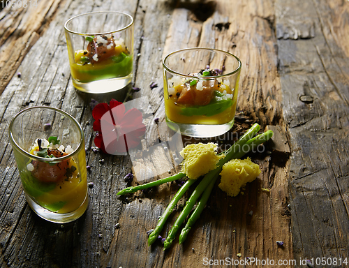 Image of Snack from salmon and puree from avocado in a glass. Film effect