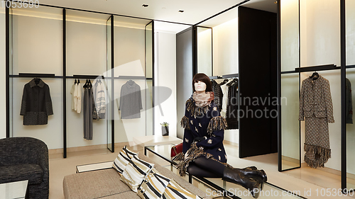 Image of Woman mannequin in luxury clothes shop