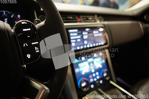 Image of Modern car interior. Shallow DOF. Steering wheel in focus