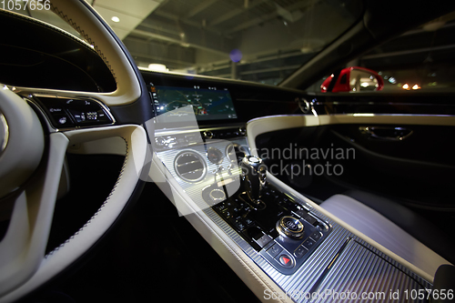 Image of Car interior luxury. Interior of prestige modern car. Dashboard and steering wheel. Focus on steering wheel.