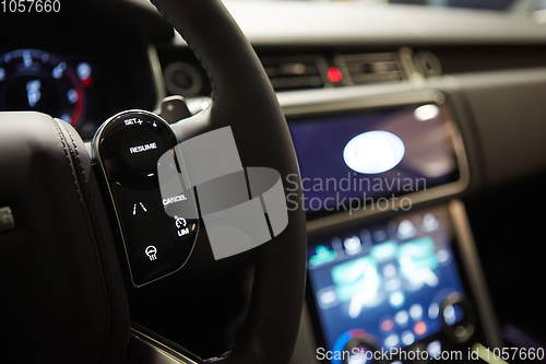 Image of Modern car interior. Shallow DOF. Steering wheel in focus