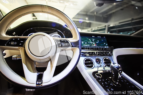 Image of Car interior luxury. Interior of prestige modern car. Dashboard and steering wheel. Focus on steering wheel.