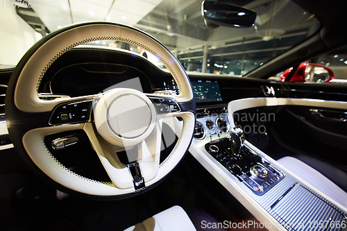 Image of Car interior luxury. Interior of prestige modern car. Dashboard and steering wheel. Focus on steering wheel.