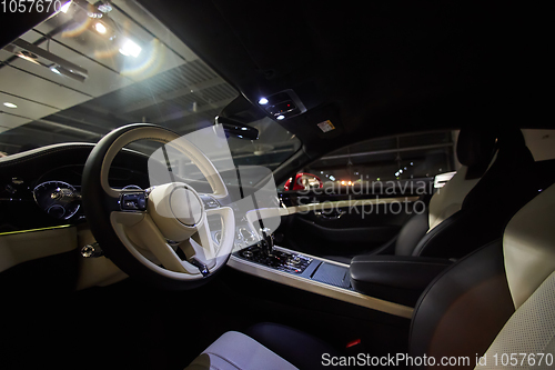 Image of Car interior luxury. Interior of prestige modern car. Dashboard and steering wheel. Focus on steering wheel.