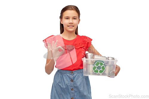 Image of smiling girl sorting metallic waste and showing ok