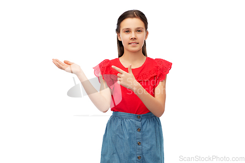 Image of happy smiling girl holding something on her hand