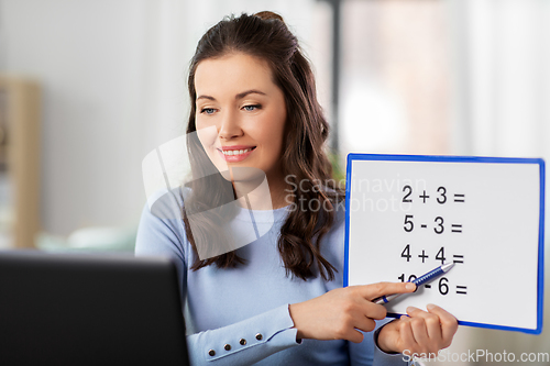 Image of math teacher having online class at home