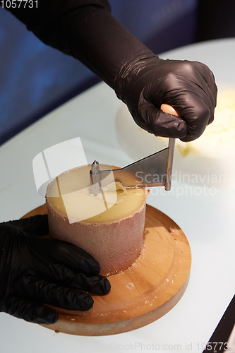 Image of Special cheese knives. The girolle scraper. Making cheese shavin