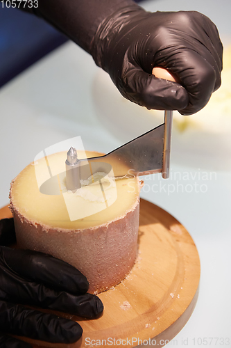 Image of Special cheese knives. The girolle scraper. Making cheese shavin