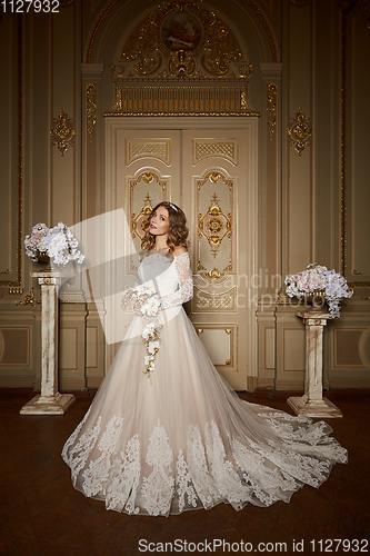Image of Beautiful bride in luxury baroque interior. Full-length portrait.