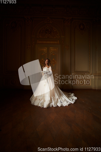 Image of Beautiful bride in luxury baroque interior. Full-length portrait