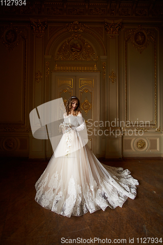 Image of Beautiful bride in luxury baroque interior. Full-length portrait