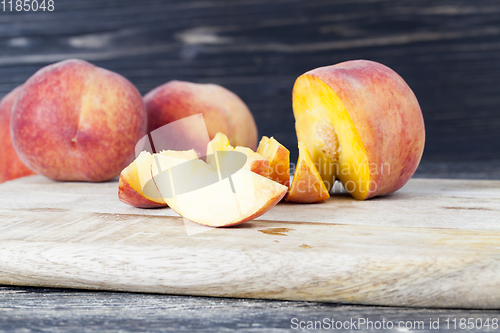 Image of cut into pieces ripe peach