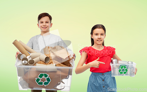 Image of smiling girl and boy sorting paper and metal waste