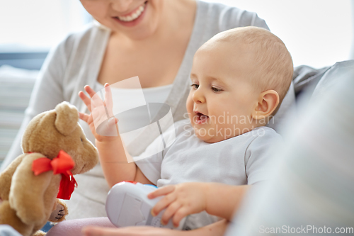 Image of close up of mother with little baby at home