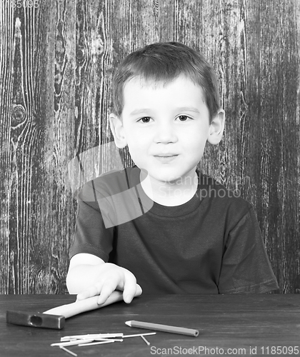 Image of boy and building tools